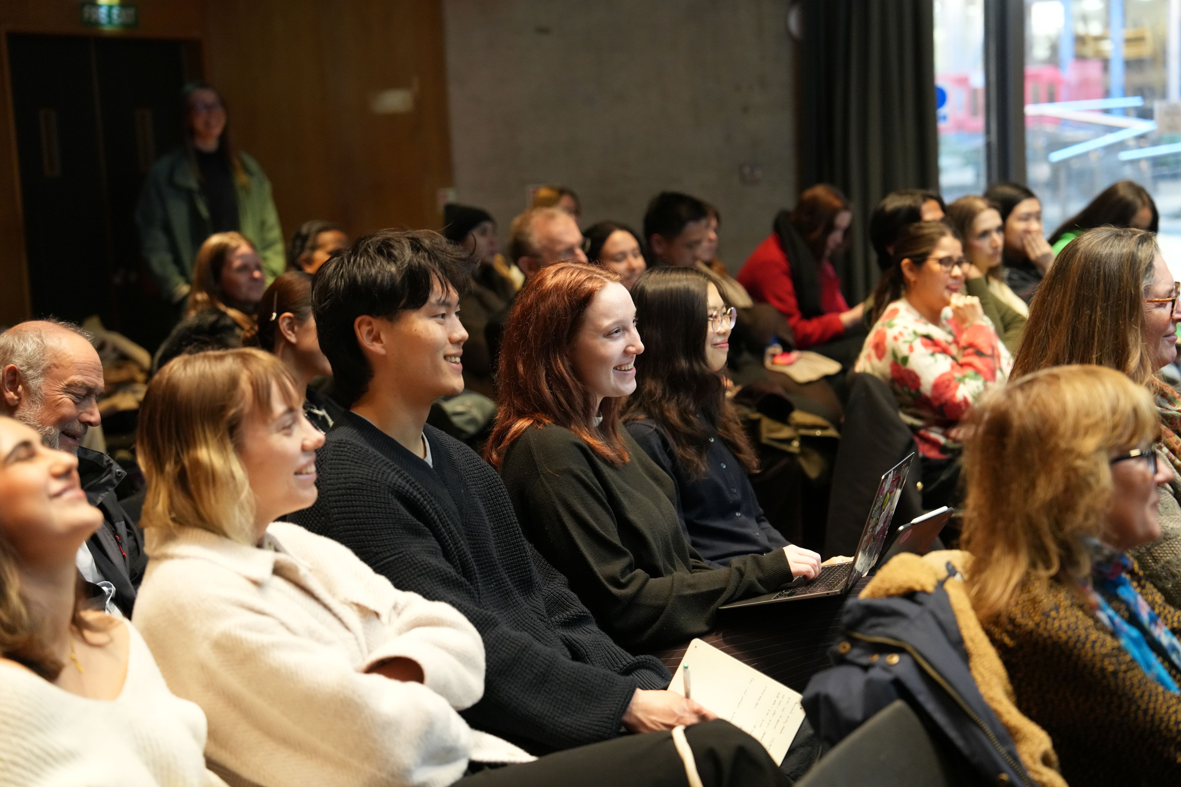 Decorative image of students in a lecture theatre